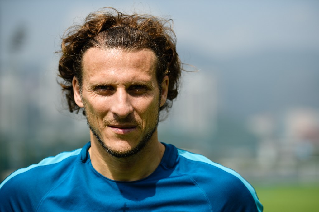 In this picture taken on March 1, 2018, Uruguayan player Diego Forlan poses before a team training session with Hong Kong Premier League football club Kitchee in Hong Kong. - Forlan has called for improvement from his new Kitchee side after a torrid start to their AFC Champions League debut campaign. (Photo by ANTHONY WALLACE / AFP)