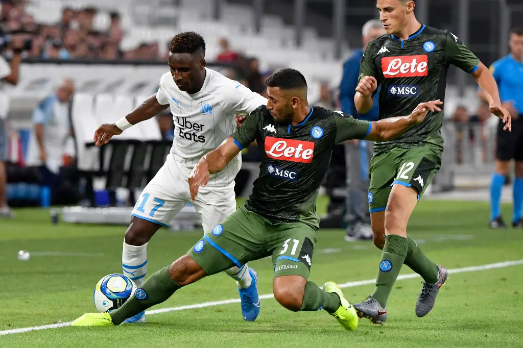 Marseille's Guinean midfielder Bouna Sarr (L) vies with Napoli's Faouzi Ghoulam (C) during the international friendly football match between Olympique de Marseille (OM) and SSC Napoli at the Velodrome Stadium in Marseille, southern France, on August 4, 2019. (Photo by GERARD JULIEN / AFP)