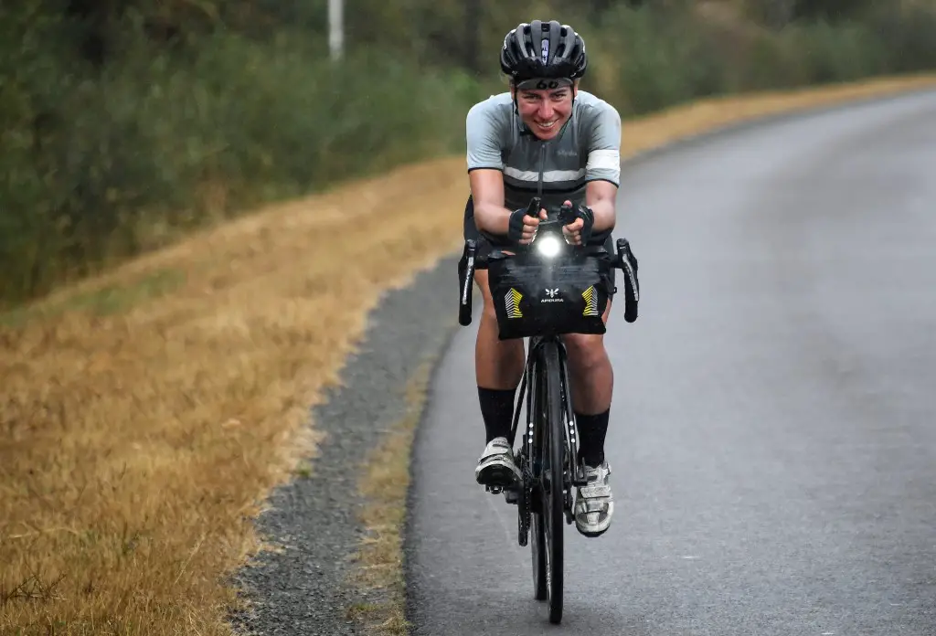 German cancer researcher from Heidelberg Fiona Kolbinger, 24, rides her bicycle on August 5, 2019 near the village of Teillay, Brittany, on her way to be the first woman to win the 2,500 miles ultra-endurance cycling Transcontinental Race from Bulgaria to western France. (Photo by Damien MEYER / AFP)
