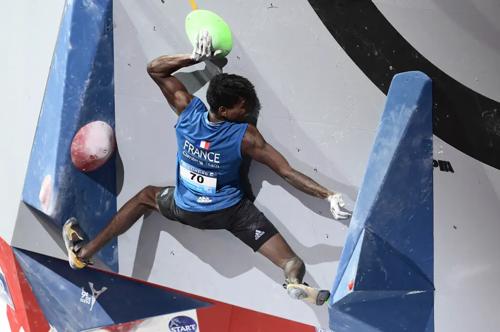 France's Mickael Mawem competes during the men's semi-final bouldering event at the indoor World Climbing and Paraclimbing Championships 2016 at the Accor Hotels Arena in Paris on September 16, 2016. (Photo by MIGUEL MEDINA / AFP)