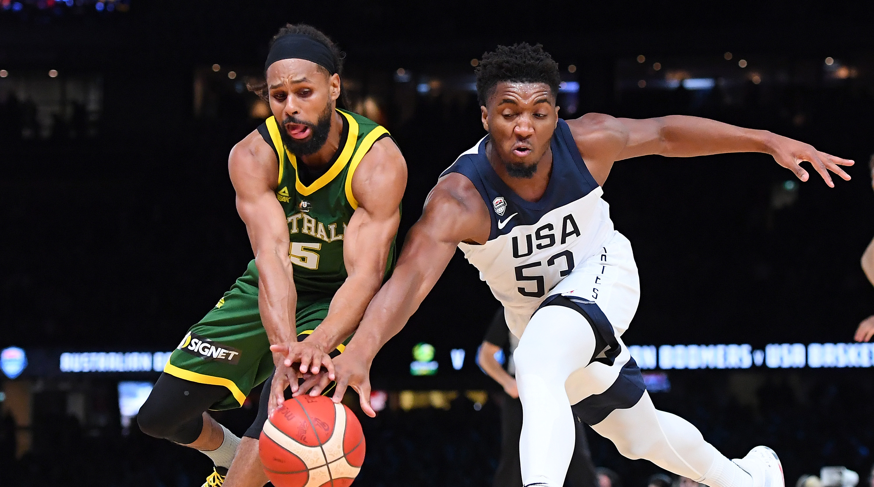 MELBOURNE, AUSTRALIA - AUGUST 22: Patrick Mills of the Boomers and Donovan Mitchell of the USA compete for the ball during the International Basketball Friendly match between the Australian Boomers and Team USA United States of America at Marvel Stadium on August 22, 2019 in Melbourne, Australia. (Photo by Quinn Rooney/Getty Images)