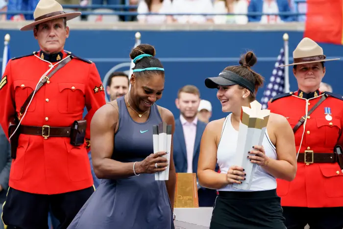 Bianca Andreescu (CAN) and Serena Williams (USA) laugh as they pose with their trophies after the Rogers Cup tennis tournament final on August 11, 2019, at Aviva Centre in Toronto, ON, Canada.