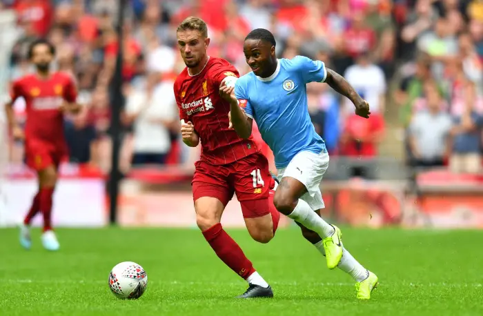 Manchester City's RaheeHSterliH in action with Liverpool's Jordan Henderson