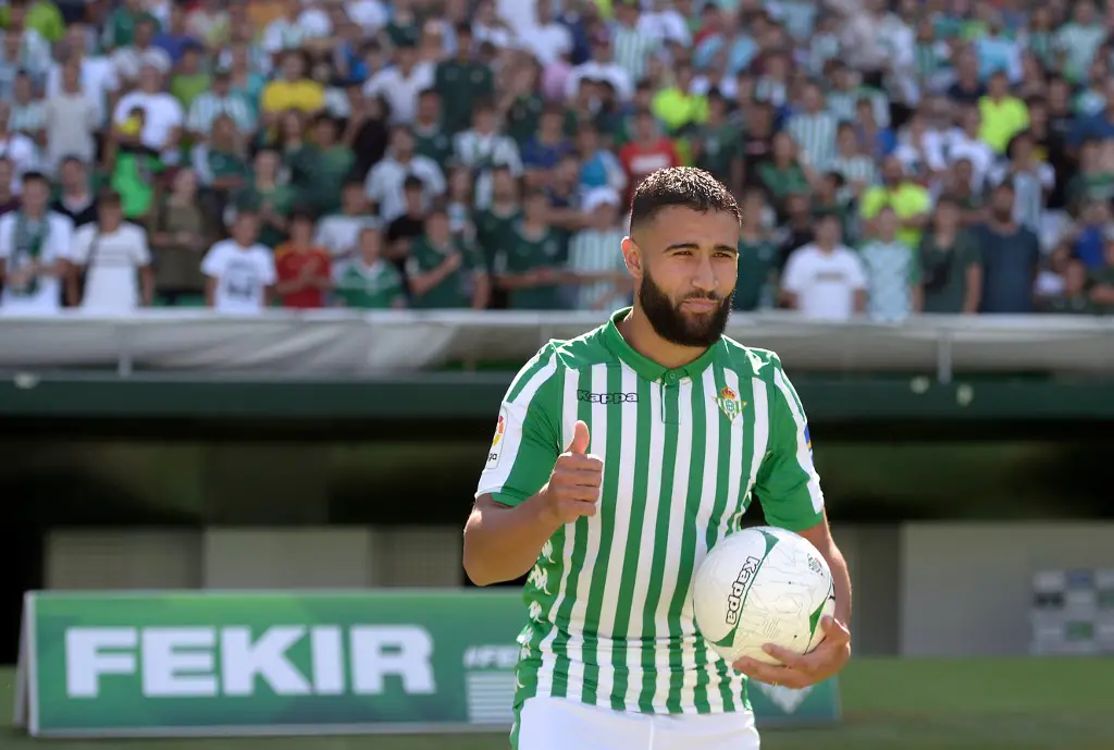 French midfielder Nabil Fekir gives a thumbs up as he poses during his official presentation as new player of Real Betis at the Benito Villamarin stadium in Seville on August 6, 2019. (Photo by CRISTINA QUICLER / AFP)