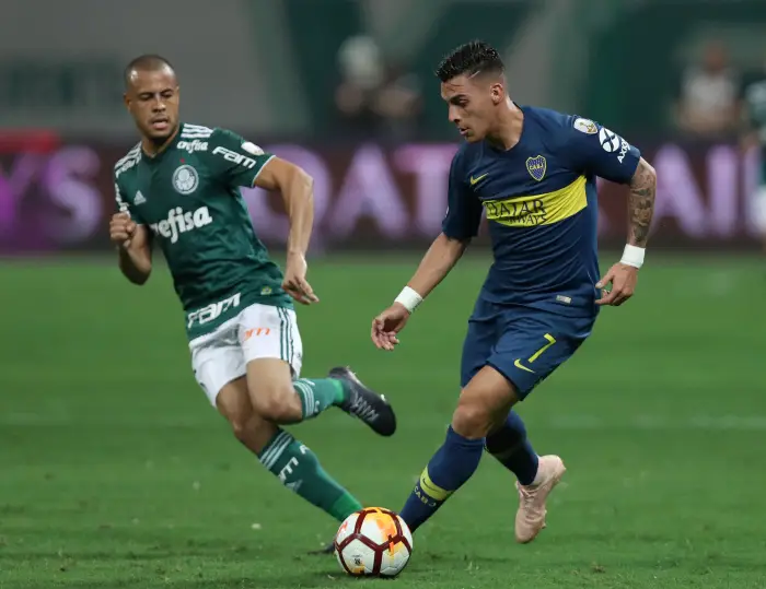 Boca Juniors' Cristian Pavon in action with Palmeiras' Mayke