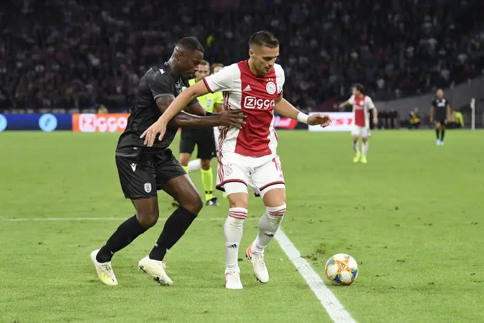 AMSTERDAM , 13-08-2019 ,Hohan CHijff ArenA , Champions League third qualifying round season 2019-2020 , PAOK player Fernando Varela and Ajax player Dusan Tadic during the match Ajax - PAOK