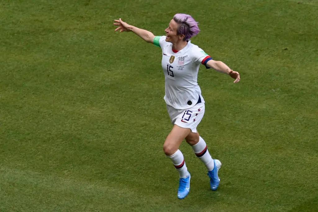 United States' forward Megan Rapinoe celebrate scoring from the penalty spot during the France 2019 Womens World Cup football final match between USA and the Netherlands, on July 7, 2019, at the Lyon Stadium in Lyon, central-eastern France. (Photo by Jean-Philippe KSIAZEK / AFP)