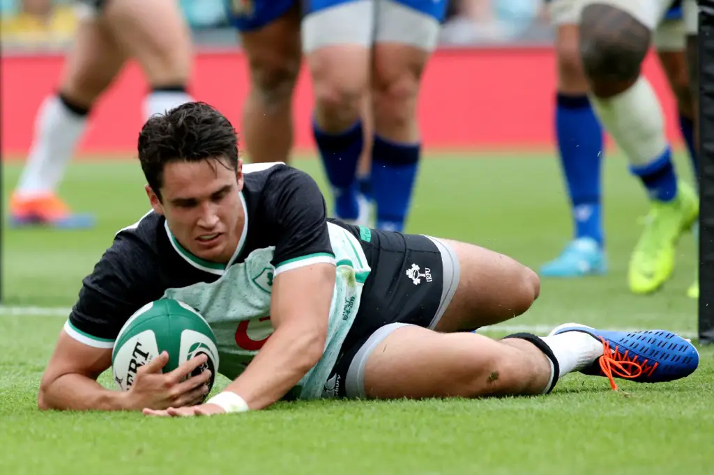 Ireland's fly-half Joey Carbery scores a try during the 2019 Rugby World Cup warm-up rugby union match between Ireland and Italy at the Aviva Stadium in Dublin, on August 10, 2019. (Photo by Paul Faith / AFP)