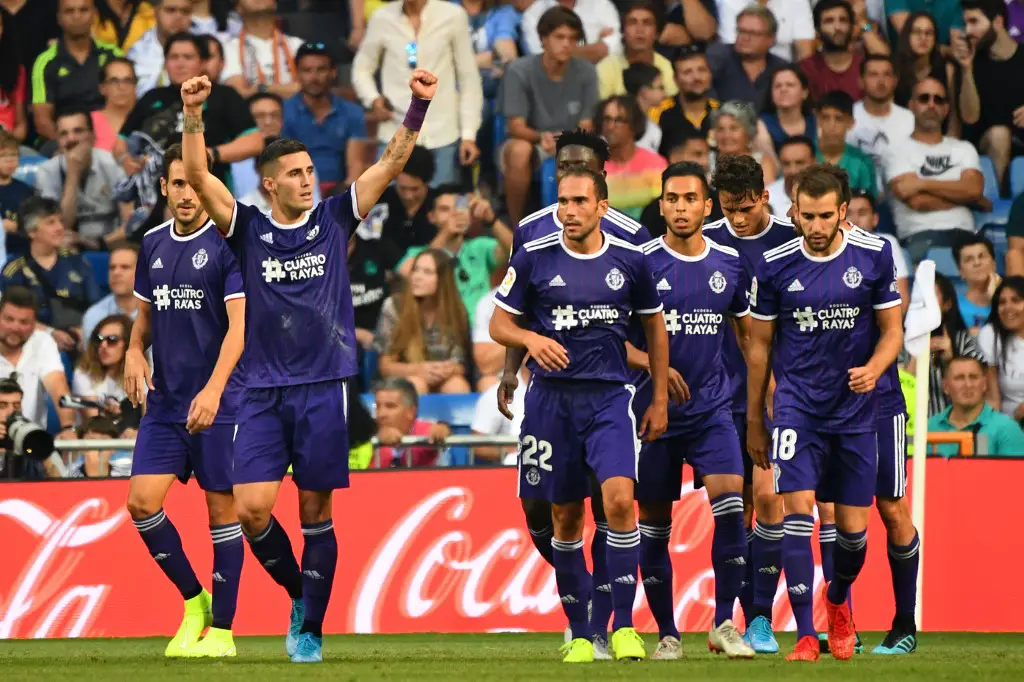 Valladolid's Spanish midfielder Sergio Guardiola (2L) celebrates after scoring during the Spanish League football match between Real Madrid and Real Valladolid at the Santiago Bernabeu stadium in Madrid on August 24, 2019. (Photo by GABRIEL BOUYS / AFP)