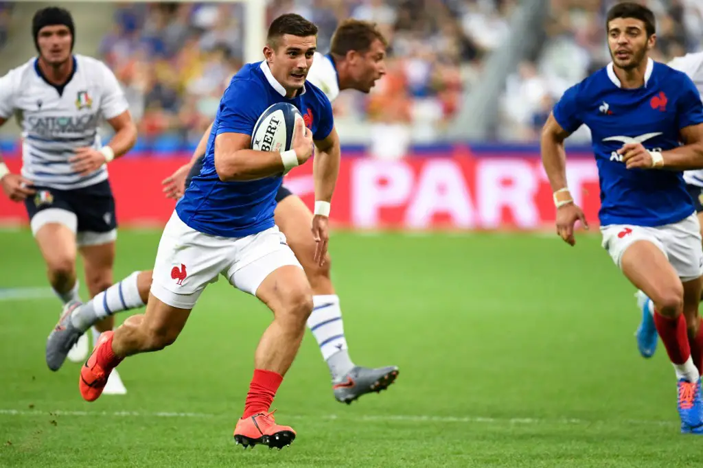 France's fullback Thomas Ramos (C-L) runs to score a try during the international Test rugby union match between France and Italy at the Stade de France in Saint-Denis, north of Paris, on August 30, 2019. (Photo by Bertrand GUAY / AFP)