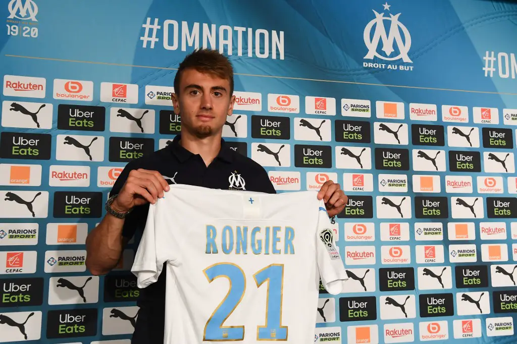 Olympique de Marseille's newly recruited midfielder Valentin Rongier, holds his new jersey during his official presentation, on September 4, 2019 at the Robert-Louis Dreyfus training centre in Marseille, southern France. (Photo by Boris HORVAT / AFP)