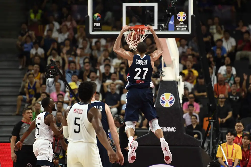 France's Rudy Gobert dunks the ball during the Basketball World Cup quarter-final game between US and France in Dongguan on September 11, 2019. (Photo by Ye Aung Thu / AFP)