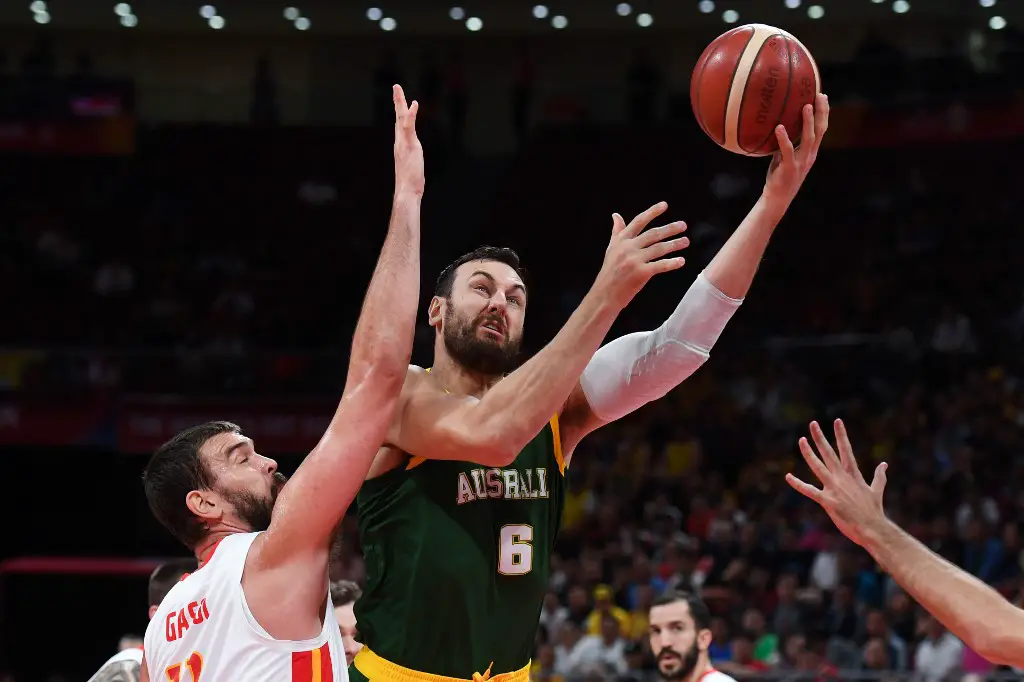 Australia's Andrew Bogut (R) goes for the basket as Spain's Marc Gasol tires to block during the Basketball World Cup semi-final game between Australia and Spain in Beijing on September 13, 2019. (Photo by Greg BAKER / AFP)