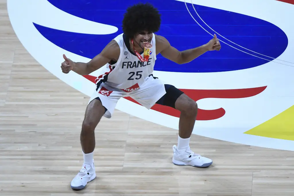 France's Louis Labeyrie celebrates with his medal after winning the Basketball World Cup third place game between France and Australia in Beijing on September 15, 2019. (Photo by WANG Zhao / AFP)