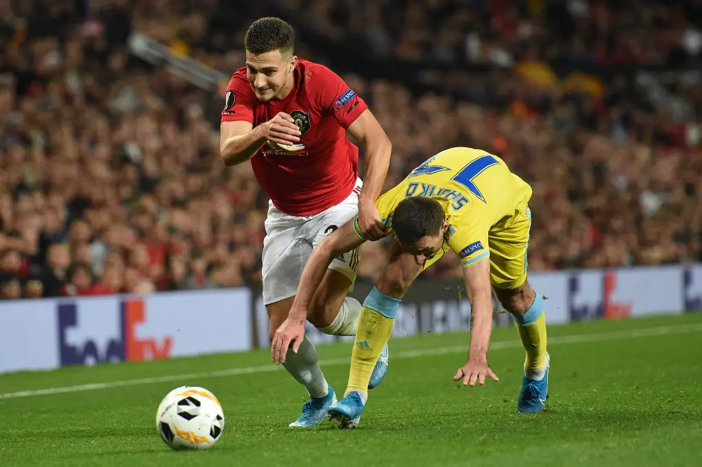 Manchester United's Portuguese defender Diogo Dalot (L) vies with Astana's Kazakh defender Dmitri Shomko (R) during the UEFA Europa League Group L football match between Manchester United and Astana at Old Trafford in Manchester, north west England, on September 19, 2019. - Manchester United won the game 1-0. (Photo by Oli SCARFF / AFP)