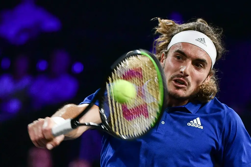 Team Europe's Stefanos Tsitsipas returns the ball to Team World's Taylor Fritz during their match as part of the 2019 Laver Cup tennis tournament in Geneva, on September 20, 2019. (Photo by Fabrice COFFRINI / AFP)