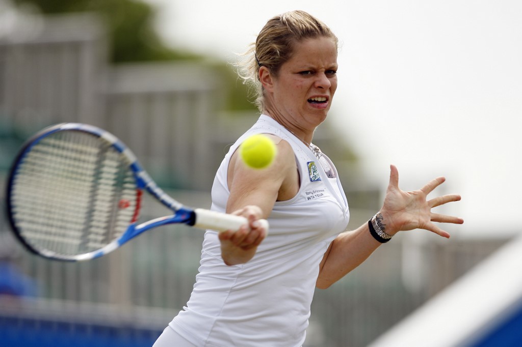 Kim Clijsters of Belgium hits a shot during her quarter final singles match against Victoria Azarenka of Belarus on the fourth day of the Eastbourne International tennis tournament in Eastbourne, southern England, on June 17, 2010.    AFP PHOTO/ GLYN KIRK (Photo by GLYN KIRK / AFP)