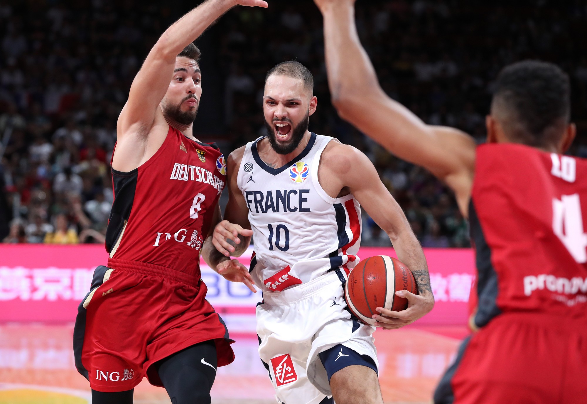 Basketball - FIBA World Cup - First Round - Group G - France v Germany - Shenzhen Bay Sports Center, Shenzhen, China - September 1, 2019 France's Evan Fournier in action with Germany's Ismet Akpinar REUTERS/Athit Perawongmetha