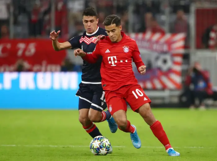 Bayern Munich's PhilippeHoutinhHin action with Crvena Zvezda's Mateo Garcia