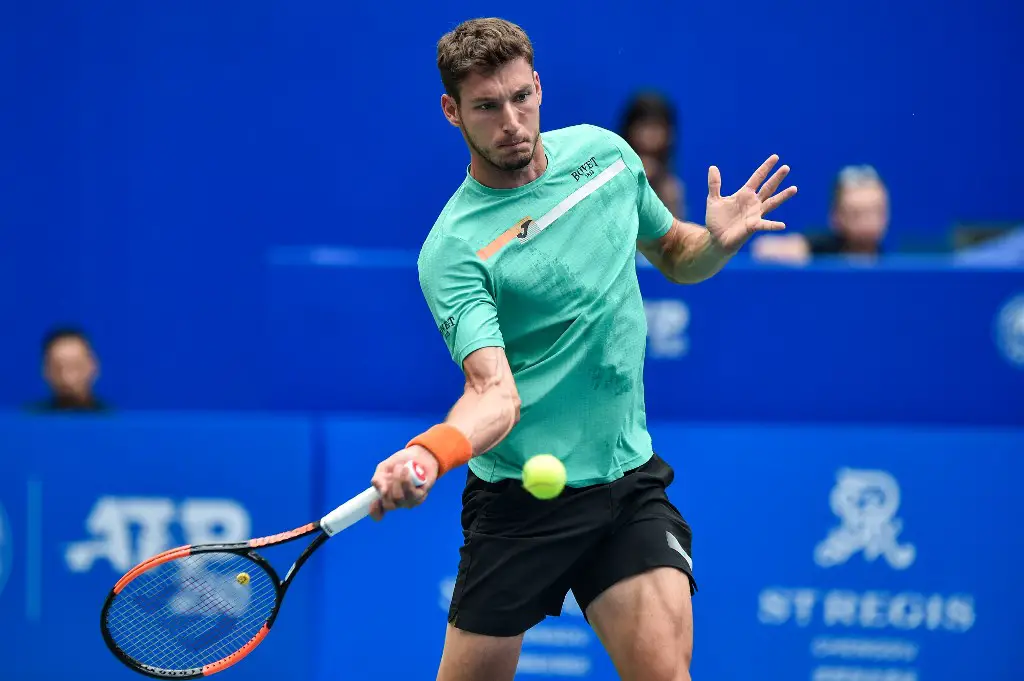 Pablo Carreno Busta of Spain hits a return against Denis Shapovalov of Canada during their men's singles semi-final match at the Chengdu Open tennis tournament in Chengdu in China's southwestern Sichuan province on September 28, 2019. (Photo by STR / AFP) / China OUT