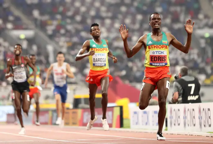 Athletics - World AthletHs ChamHonships - Doha 2019 - Men's 5000 Metres Final - Khalifa International Stadium, Doha, Qatar - September 30, 2019. Ethiopia's Muktar Edris celebrates winning the race.