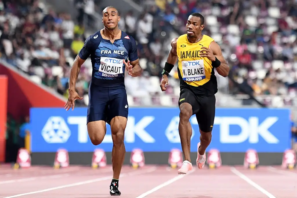 (L-R) France's Jimmy Vicaut and Jamaica's Yohan Blake compete in the Men's 100m heats at the 2019 IAAF World Athletics Championships at the Khalifa International stadium in Doha on September 27, 2019. (Photo by Jewel SAMAD / AFP)