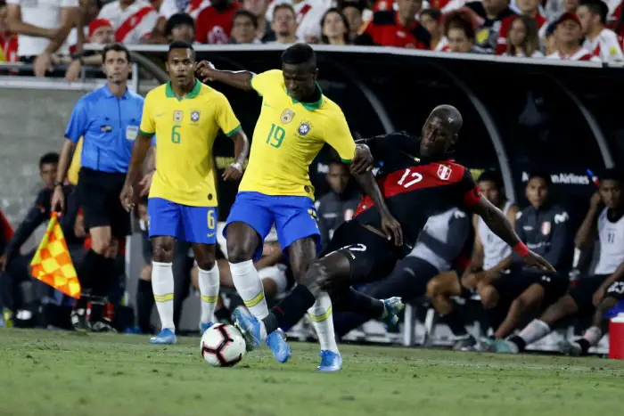Brazil forward ViniciusHr. (19Hand Peru defender Luis Advincula (17) vie for the ball during an International Friendly Soccer match