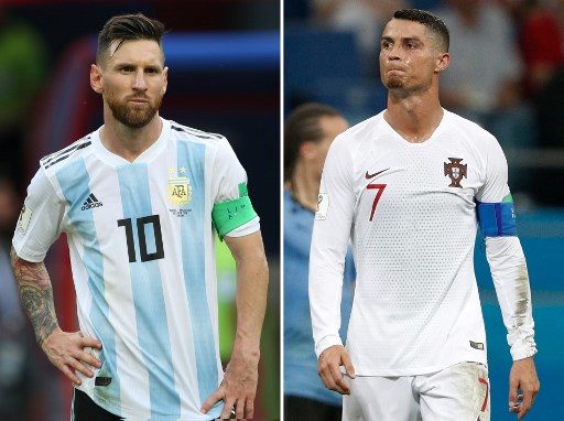 (COMBO) This combination of two files pictures created on June 30, 2018 shows Argentina's forward Lionel Messi (L) in Kazan on June 30, 2018 and Portugal's forward Cristiano Ronaldo in Sochi on June 30, 2018. - Cristiano Ronaldo and Lionel Messi saw their World Cup dreams snuffed out on June 30, 2018. (Photo by Roman KRUCHININ and Adrian DENNIS / AFP)