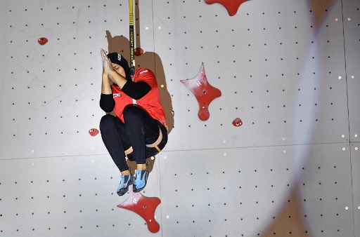 Indonesia's Susanti Rahayu Aries reacts during the final of the women's speed sport climbing event at the 2018 Asian Games in Palembang on August 23, 2018. (Photo by ADEK BERRY / AFP)