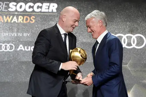 Head coach of the French national football team, Didier Deschamps (R) receives from FIFA president Gianni Infantino the "Best Coach of the Year 2018 Award" during the 10th edition of the Dubai Globe Soccer Awards on January 3, 2019 in Dubai. (Photo by Fabio FERRARI / La Presse / AFP) / Italy OUT - China OUT
