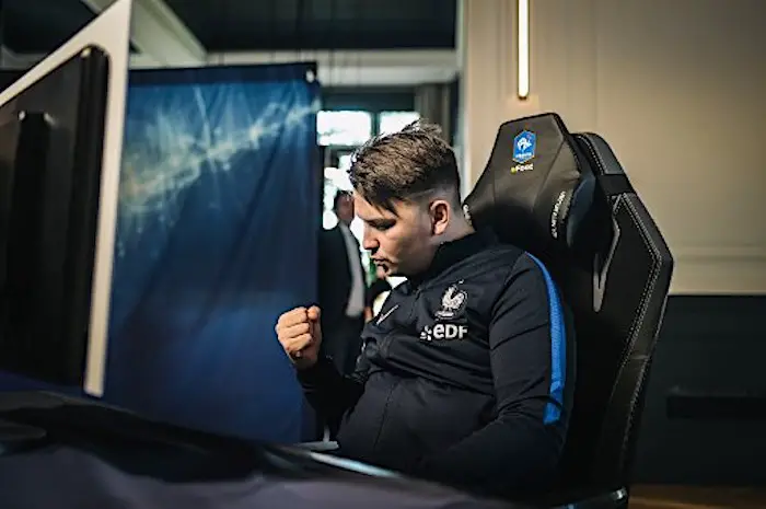 French E-sport pro gamer Corentin Thullier "Maestro" reacts during the French national efoot selection 2019, designating the 6 best French FIFA players, at the French national football team base camp in Clairefontaine en Yvelines on February 12, 2019. - The 6 best French FIFA players integratating the French efoot team for one year, experience living the French football team players' life at the Clairefontaine base camp, AFP reported on February 14, 2019. (Photo by LUCAS BARIOULET / AFP)