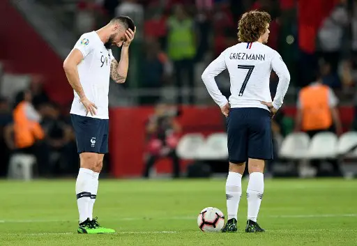 France's Forward Olivier Giroud (L), and France's forward Antoine Griezmann react after Turkey's scoring their second goal during the Euro 2020 football qualification match between Turkey and France at the Buyuksehir Belediyesi stadium in Konya, on June 8, 2019. (Photo by Bulent Kilic / AFP)