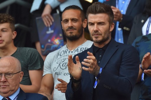 England's football legend David Beckham applauds ahead ofthe France 2019 Women's World Cup quarter-final football match between Norway and England, on June 27, 2019, at the Oceane stadium in Le Havre, north western France. (Photo by LOIC VENANCE / AFP)