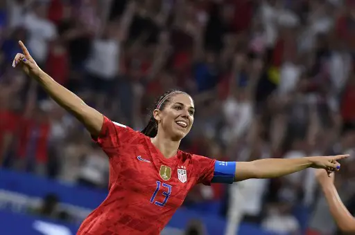 United States' forward Alex Morgan celebrates after scoring a goal during the France 2019 Women's World Cup semi-final football match between England and USA, on July 2, 2019, at the Lyon Satdium in Decines-Charpieu, central-eastern France. (Photo by Philippe DESMAZES / AFP)