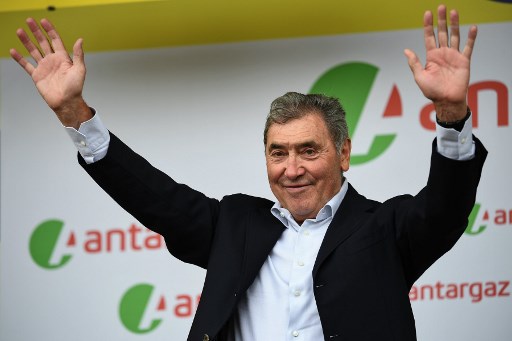 Belgian legend Eddy Merckx waves before the podium ceremony of the first stage of the 106th edition of the Tour de France cycling race between Brussels and Brussels, Belgium, on July 6, 2019. (Photo by Anne-Christine POUJOULAT / AFP)