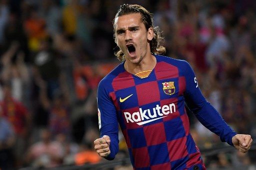 Barcelona's French forward Antoine Griezmann celebrates after scoring the first goal during the Spanish league football match between FC Barcelona and Villarreal CF at the Camp Nou stadium in Barcelona, on September 24, 2019. (Photo by LLUIS GENE / AFP)