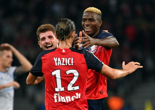 Lille's Nigerian forward Victor Osimhen celebrates after scoring a goal during the French L1 football match between Lille LOSC and Racing Club Strasbourg Alsace at the Pierre-Mauroy Stadium in Villeneuve d'Ascq, northern France on September 25, 2019. (Photo by DENIS CHARLET / AFP)