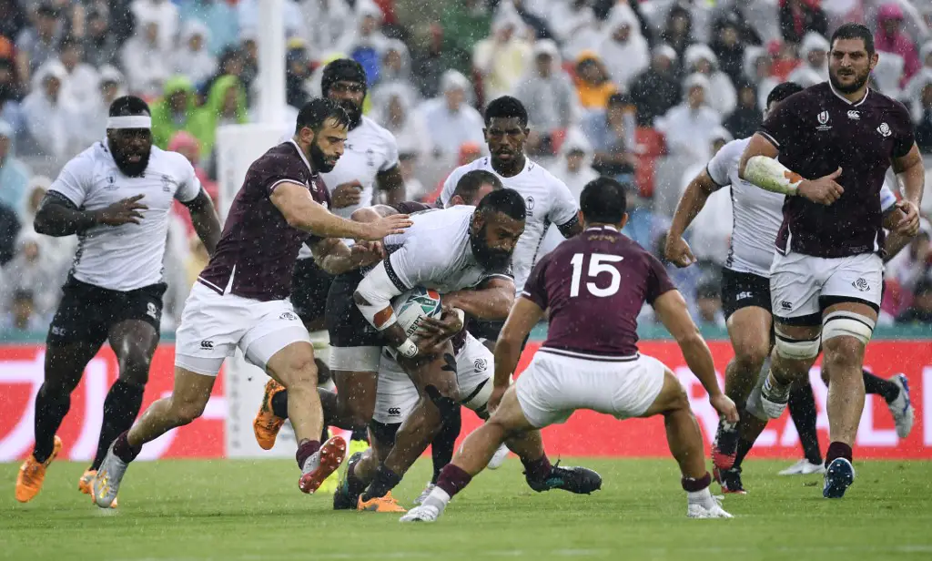 Fiji's centre Waisea Nayacalevu (C) runs with the ball during the Japan 2019 Rugby World Cup Pool D match between Georgia and Fiji at the Hanazono Rugby Stadium in Higashiosaka on October 3, 2019. (Photo by Filippo MONTEFORTE / AFP)
