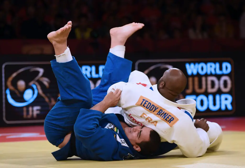 France's Teddy Riner (R) fights against Brazil's David Moura during the men's over 100 kg category final combat of the Judo Grand Slam Brasilia 2019, in Brasilia, on October 8, 2019. (Photo by EVARISTO SA / AFP)