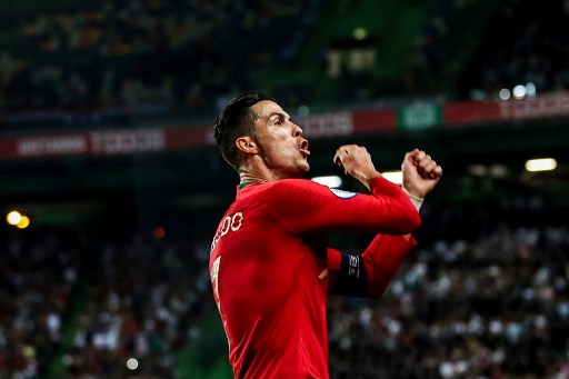Portugal's forward Cristiano Ronaldo celebrates after scoring a goal during the Euro 2020 qualifier group B football match between Portugal and Luxembourg at the Jose Alvalade stadium in Lisbon on October 11, 2019. (Photo by CARLOS COSTA / AFP)
