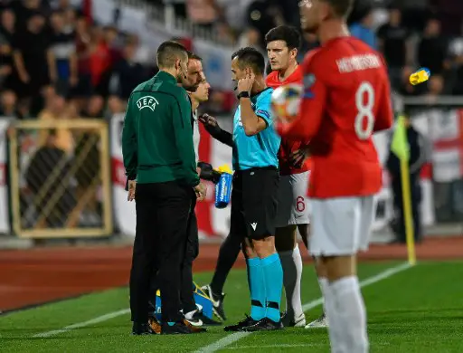 England's head coach Gareth Southgate (2nd-L) looks on during a temporary interruption of the Euro 2020 Group A football qualification match between Bulgaria and England due to incidents with fans, at the Vasil Levski National Stadium in Sofia on October 14, 2019. (Photo by NIKOLAY DOYCHINOV / AFP)