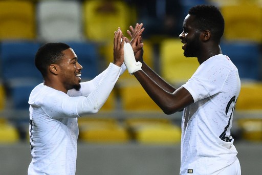 Frances Arnaud Nordin and Frances forward Odsonne Edouard celebrate their goal during the Under 21 Euro 2021 qualifying football match between Slovakia and France on October 15, 2019 at the MOL Arena in Dunajska Streda. (Photo by VLADIMIR SIMICEK / AFP)