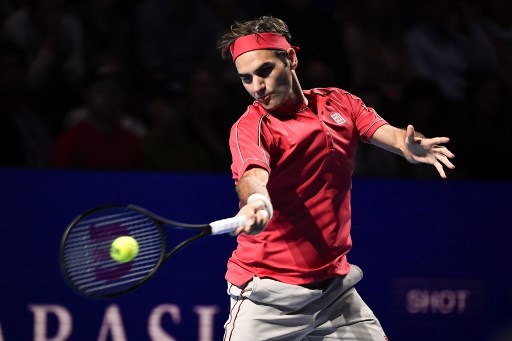 Swiss Roger Federer returns a ball to German Peter Gojowczyk during the 1,500th match of his career at the opening day of the Swiss Indoors tennis tournament on October 21, 2019 in Basel. - Roger Federer check off another landmark on October 21, 2019 when he starts his bid for a 10th Basel title by playing the 1,500th match of his career. (Photo by FABRICE COFFRINI / AFP)