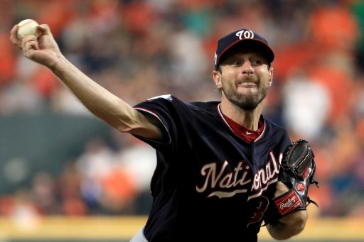 (FILES) In this file photo taken on October 22, 2019 Max Scherzer #31 of the Washington Nationals delivers the pitch against the Houston Astros during the third inning in Game One of the 2019 World Series at Minute Maid Park in Houston, Texas. - Houston ace pitcher Gerrit Cole tries to avenge his only loss since May when he faces a rematch against Washington's Max Scherzer in Sunday's crucial fifth game of the World Series. (Photo by Mike Ehrmann / GETTY IMAGES NORTH AMERICA / AFP)