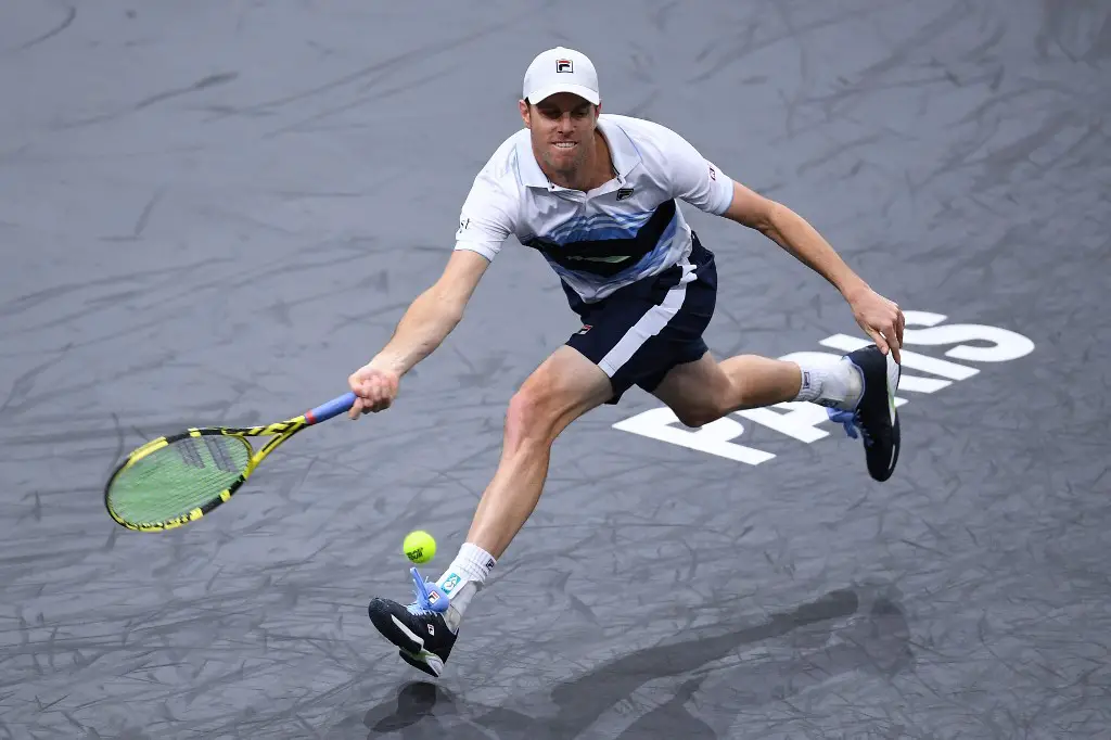 USA's Sam Querrey returns the ball to France's Jeremy Chardy during their men's singles tennis match on day one of the ATP World Tour Masters 1000 - Rolex Paris Masters - indoor tennis tournament at The AccorHotels Arena in Paris on October 28, 2019. (Photo by Christophe ARCHAMBAULT / AFP)