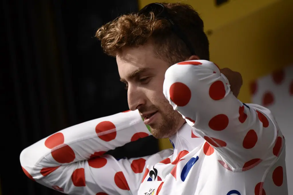 USA's Taylor Phinney puts his polka dot jersey of best climber on the podium at the end of the 203,5 km second stage of the 104th edition of the Tour de France cycling race on July 2, 2017 between Dusseldorf, Germany and Liege, Belgium. (Photo by Jeff PACHOUD / AFP)