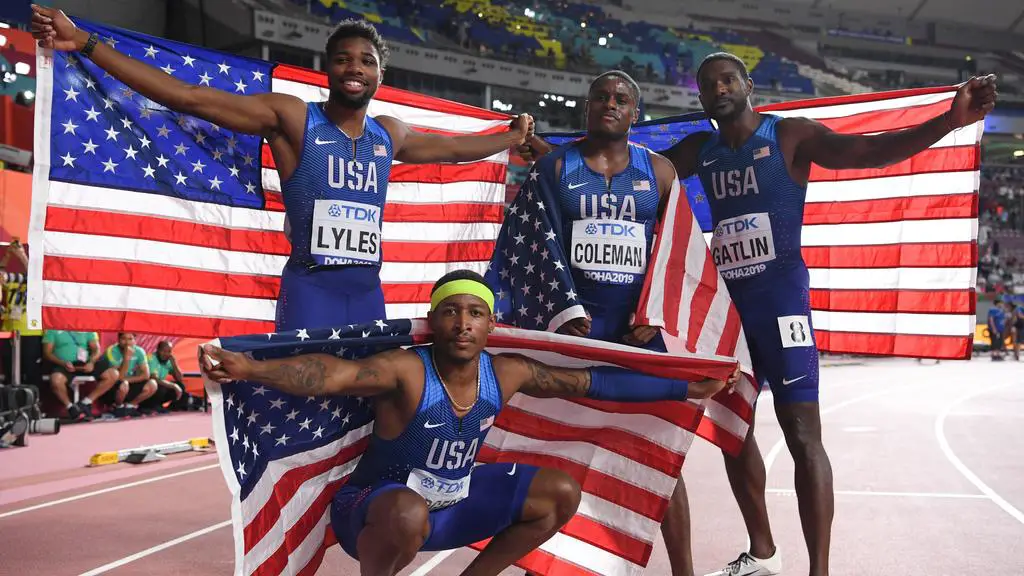 (L-R) USA's Noah Lyles, USA's Michael Rodgers, USA's Christian Coleman and USA's Justin Gatlin celebrate winning the Men's 4x100m Relay final at the 2019 IAAF Athletics World Championships at the Khalifa International stadium in Doha on October 5, 2019. (Photo by Kirill KUDRYAVTSEV / AFP)