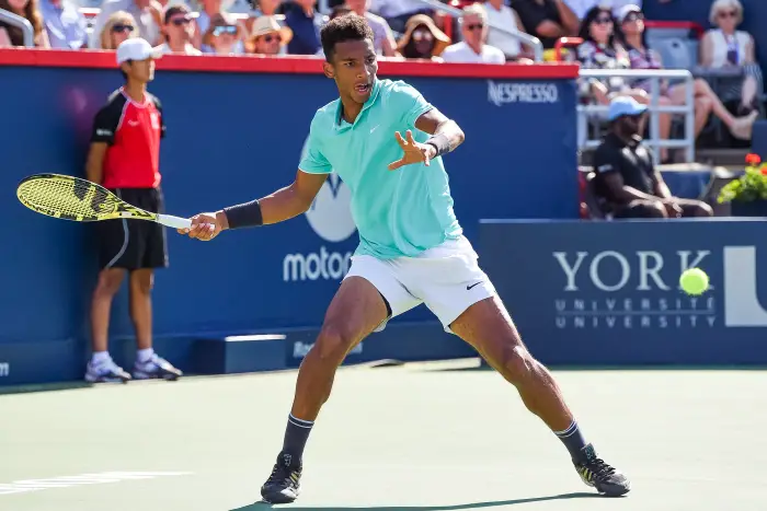 MONTREAL, QC - AUGUST 08: Felix Auger-Aliassime (CAN) returns the ball during the ATP Coupe Rogers third round match on August 8, 2019 at IGA Stadium in Montréal, QC