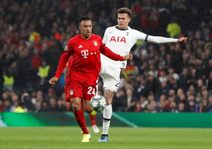 Bayern Munich's CorentiHTolissHin action with Tottenham Hotspur's Dele Alli