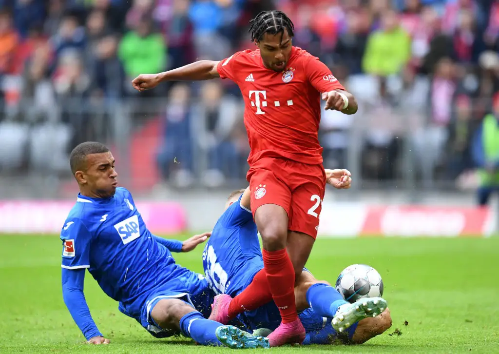Hoffenheim's German defender Kevin Akpoguma (L), Hoffenheim's Austrian defender Stefan Posch and Bayern Munich's German midfielder Serge Gnabry (C) vie for the ball during the German first division Bundesliga football match FC Bayern Munich vs TSG 1899 Hoffenheim in Munich, southern Germany, on October 5, 2019. (Photo by Christof STACHE / AFP) / DFL REGULATIONS PROHIBIT ANY USE OF PHOTOGRAPHS AS IMAGE SEQUENCES AND/OR QUASI-VIDEO
